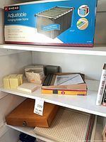 Overview showing boxed Smead frame, memo pads, wooden chess box, cutting mat