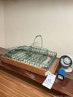 tray with two wire baskets, lamp and flashlight