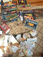 Overview of lot showing fruit crate labels, postcards in sleeves, envelopes and bags of stamps