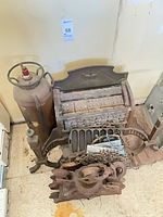 Overhead view of entire lot showing extinguisher, grate, and assorted cast-iron parts