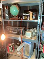 Entire metal shelving unit with all items visible