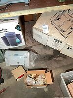 Overall lot showing boxed humidifier, boxed sink, loose appliance and box of copper fittings