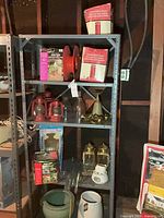 Full shelving unit with assorted lighting, planters, accessories