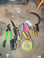 Full layout of all garden tools and trimmer line on floor