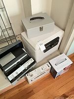 Group shot showing safe, cash box, Tower device, two boxed electronics