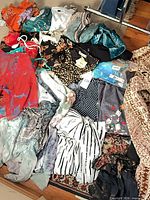 Overhead view of all garments spread on floor showing variety