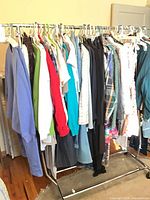 Full view of clothing lot on rolling rack