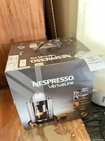 Front of boxed Nespresso VertuoLine coffee maker