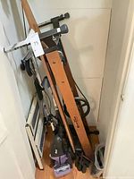 Overall view of lot showing NordicTrack wood machine, Shark vacuum, folding panels and hoses