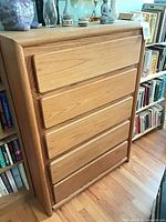 Front view of oak veneer tall dresser with six drawers