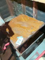 Top view of first wooden side table showing finish and wear