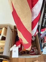 Striped section of aged flag resting in box