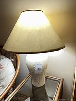 Lamp on side table showing full lamp with shade