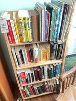 full view of bookshelf loaded with books
