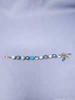 Full view of bracelet laid flat showing all crystal settings