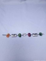 Full view of bracelet showing all alternating stone and metal links