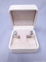 Pair of stud earrings in open Charm Diamond Centres box