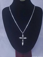 Full necklace on stand showing chain length and pendant