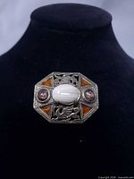 Front view showing stones, dragon design