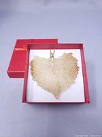 leaf pendant necklace in box, top view