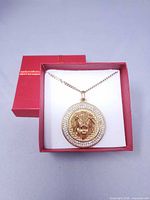 Necklace displayed in red box, full view