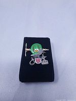 Front view showing hat, banner and charms