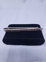 Full view of money clip on display stand