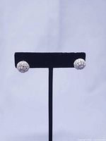 Front view showing pavé crystal sphere sides on display stand