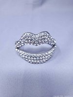 Front view of rhinestone lips bangle