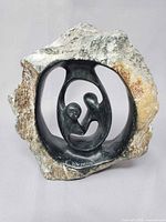 Front view showing full sculpture and inscription