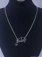 Full necklace on display bust showing chain and pendant