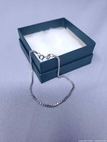 Bracelet displayed on teal gift box