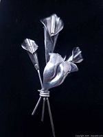 front view of sterling silver lily bouquet brooch