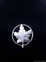 Front view of sterling silver maple leaf pin