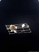 Front view showing musical staff design with rose and notes