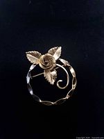 Front view of gold-finish sterling silver rose brooch