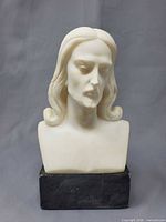 Front view of alabaster bust on marble base