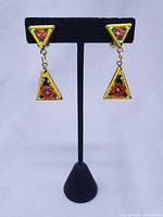 Front view showing full pair of earrings on stand