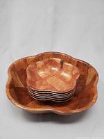 Overall view of serving bowl stacked with six individual bowls