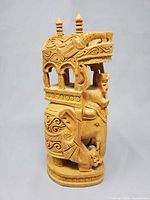 Full view of carved wooden Ambabari elephant sculpture