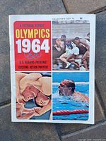 Cover of A Pictorial Report Olympics 1964 magazine showing runners, wrestler, swimmer images