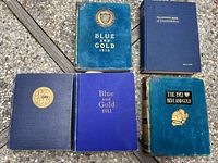 Five volumes arranged to show covers and titles