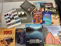 All books and stamp sheet laid out on table