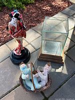 Overall lot with Geisha doll, glass display case, and basket with two baby dolls