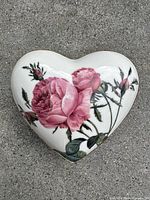 Top view showing rose design on heart-shaped lid