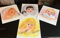 Five loose prints showing various Northern Tissue baby illustrations