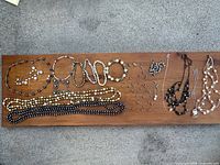 All jewelry laid out on board showing quantity and variety
