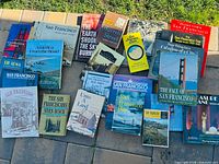 All books laid out on patio showing covers and titles
