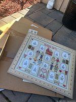 Front view of unboxed School Days frame displaying printed mat and ruler border; sealed frames beneath