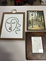 Front view showing all three framed prints